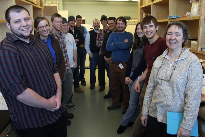 A group of students and professor smiling for the camera at Mount Desert Island Biological Laboratory