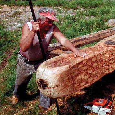 Photo of Bernard Langlais sculpting the Owl statue