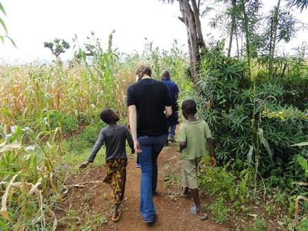 Photo of Brigitte Pratt with two children in Tanzania