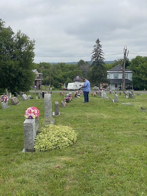 Anthony Scott, instructor at the Maine School of Science and Mathematics, conducts cemetery mapping at Old Holy Rosary Cemetery in Caribou.