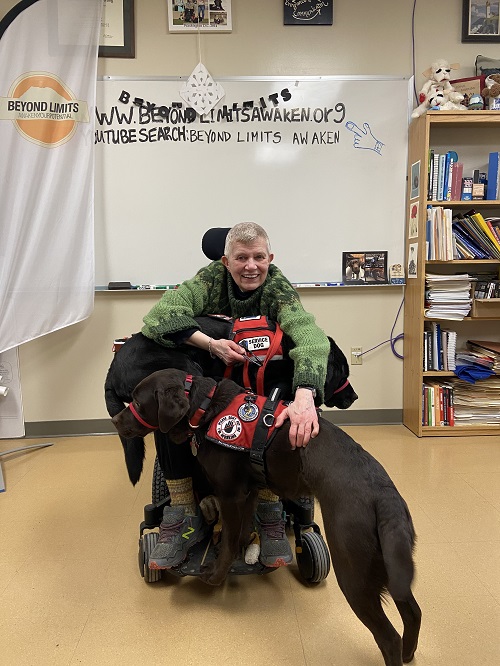 Dr. Jacqui Lowman and her service dogs Saint and Dusty