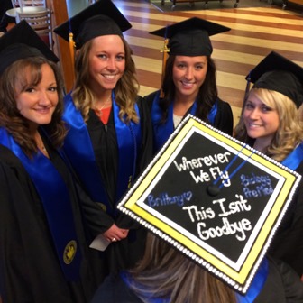 Photo of four graduates with a cap with text "Wherever we fly, this isn't goodbye"