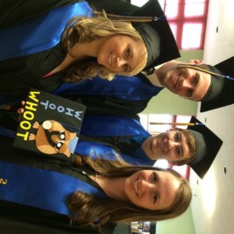 Photo of four graduates with cap and text "Whoot Whoot"