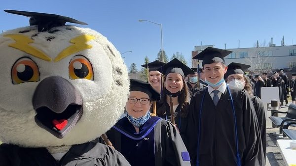 Photo of Hootie mascot and graduation marshals