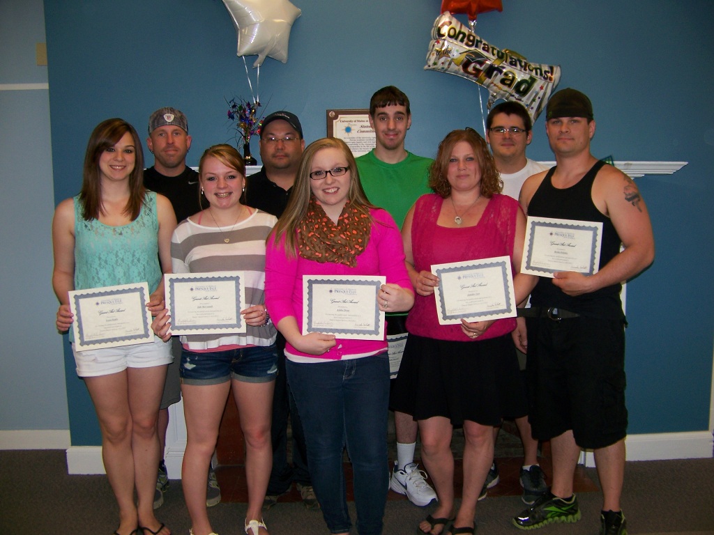 Photo of nine students receiving scholarship grants