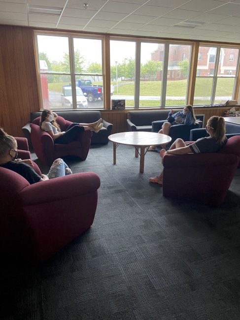 Photo of students relaxing on the couches in the Emerson Hall lounge