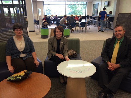 Photo of three UMPI officials sitting in the CIL