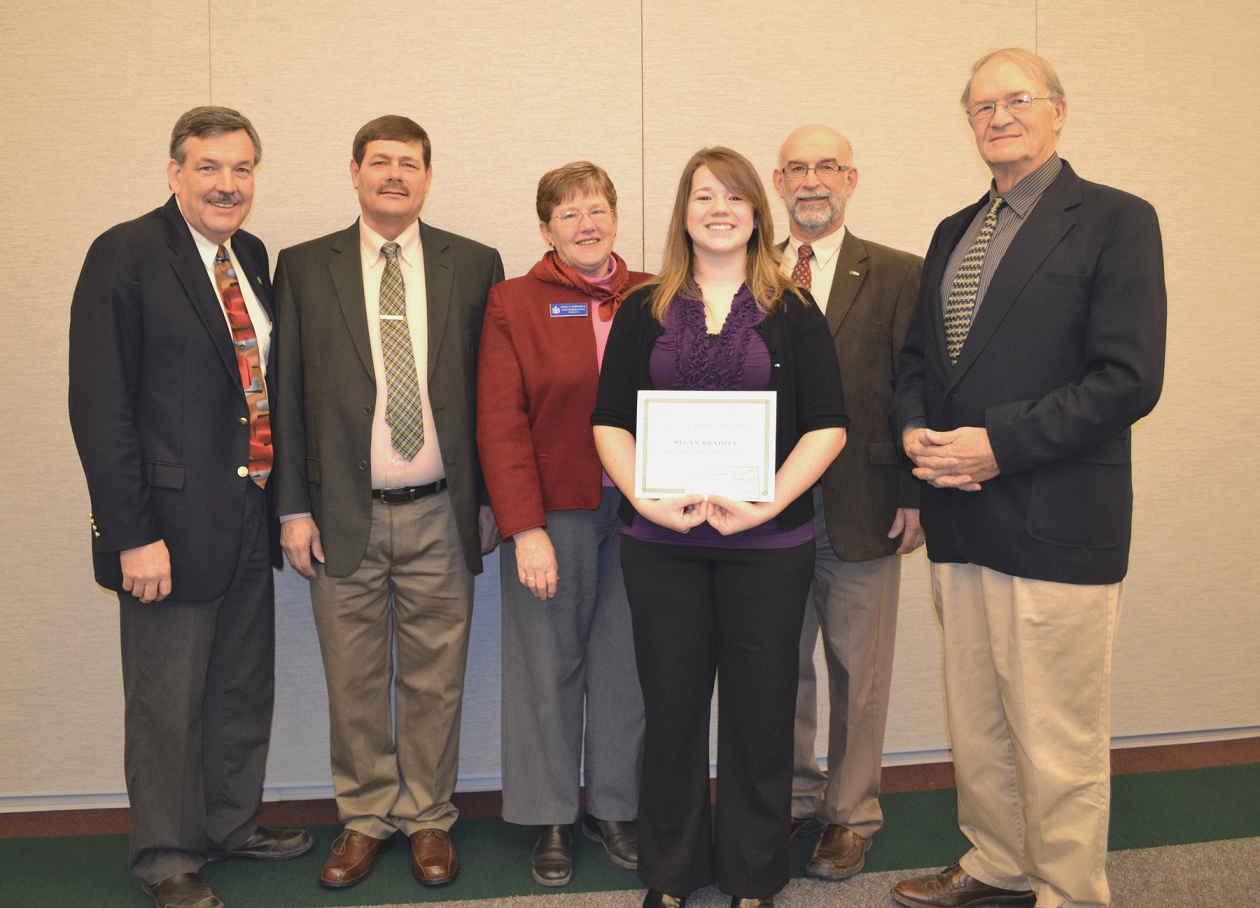 Megan Bradley receiving a scholarship from five UMPI officials