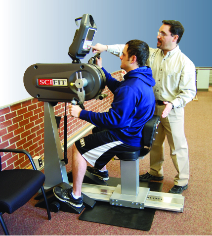 Photo of student learning to use physical therapy equipment with teacher