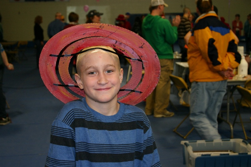 Child with a planet-shaped hat