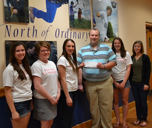 Photo of, from left, Carly Bell, club president; Leigh Belair, club co-advisor; Bonnie Corey, club member; Jonathan Cote, Aroostook Advisory Board Chair of the Northern & Eastern American Red Cross of Maine; Abigail Riitano, club member; and Kaitlyn Belanger, club member