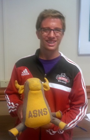 Photo of Gregory Doane holding the school mascot