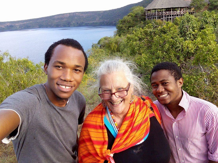 Photo of Professor Shirley Rush and two others overlooking a lake in Tanzania