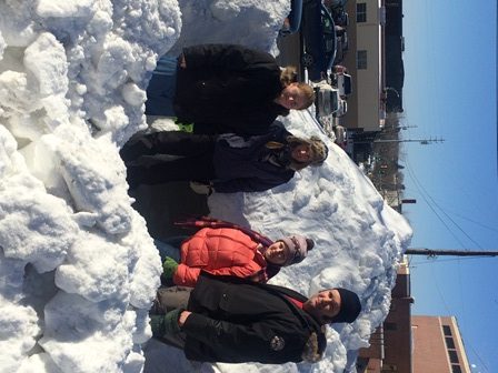 Photo of four people outside on a snowy day