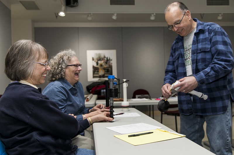 Photo of three seniors at a SAGE class