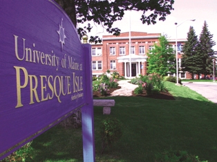 UMPI sign with Preble Hall in the background