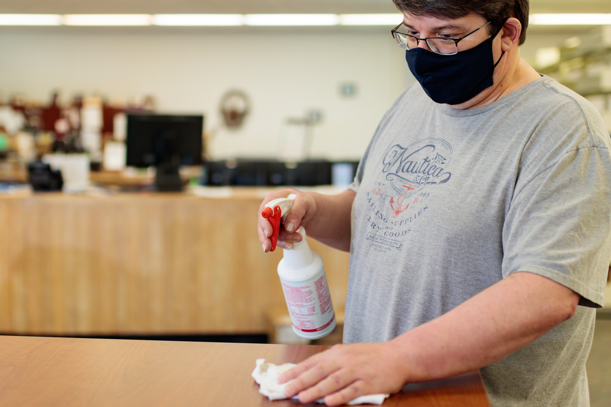 Photo of Roger Getz cleaning a table