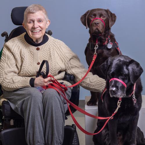 photo of jacqui lowman with her service dogs